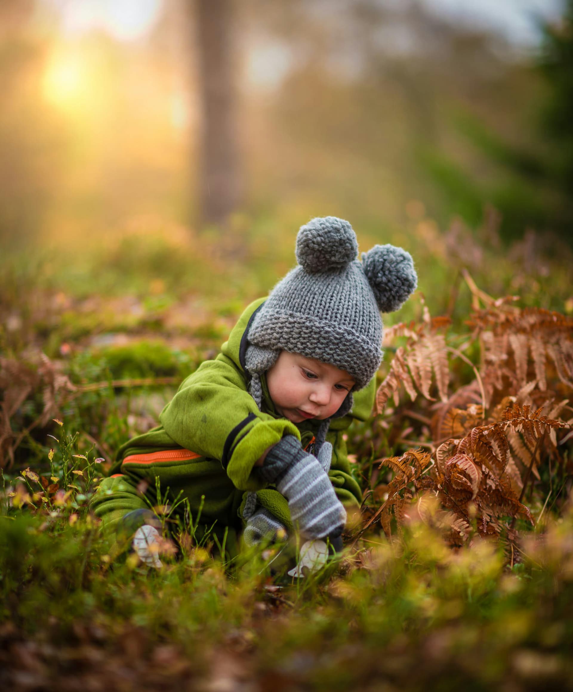 Kid playing in the grass